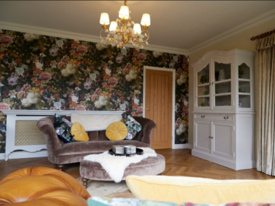 Highly Decorated Living Room, Patterned Wall, White Cabinet, Traditional Style Sofa and Foot Rest