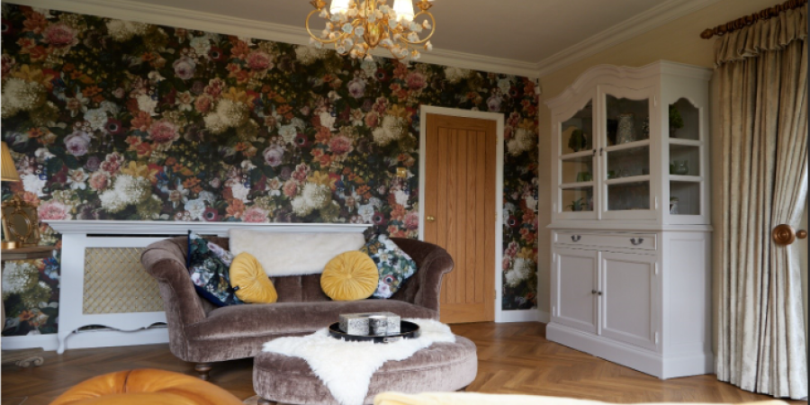 Highly Decorated Living Room, Patterned Wall, White Cabinet, Traditional Style Sofa and Foot Rest